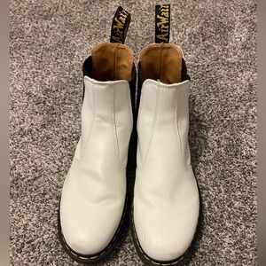Women’s size 12 Dr. Martens white boots. (Excellent condition).
